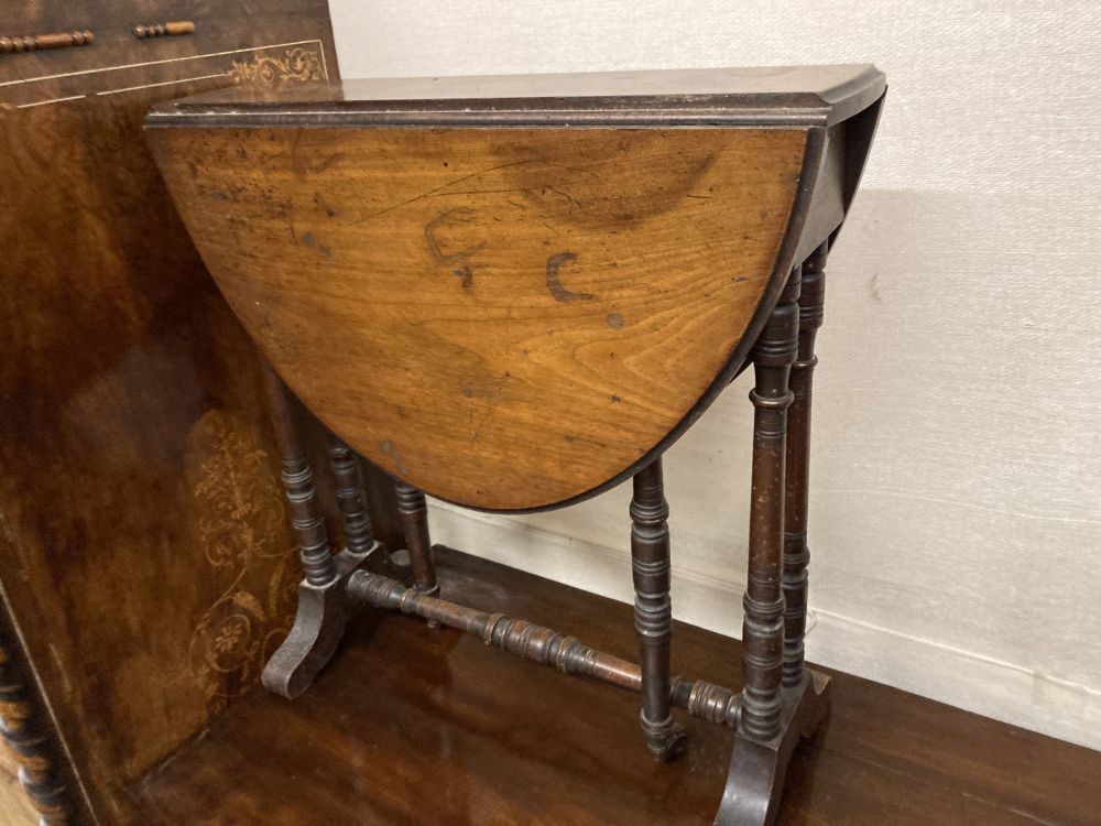 A late Victorian walnut Sutherland table, width 53cm height 56cm, together with a childs rush seat elbow chair